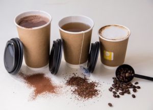 Three Hot Cups containing tea and coffee, with lids next to them