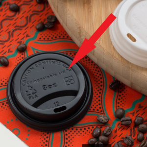 Photo of a Hot Cup Lid with an arrow to where it is embossed with the words 'Compostable Lid'