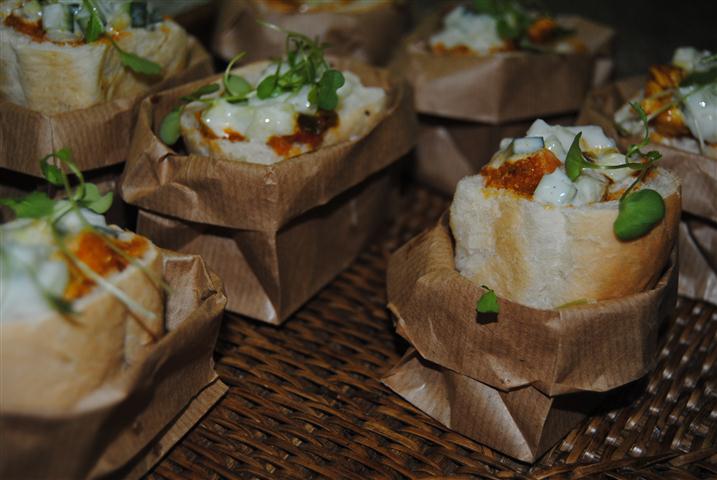 Bunny chow served in brown paper bags